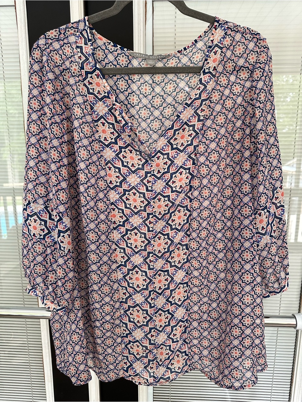 Size 2X Valerie Stevens Pink and Navy Floral-Geometric V-Neck blouse.